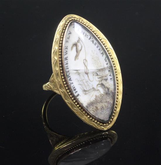 An early 19th century gold and ivory mourning ring, size M.